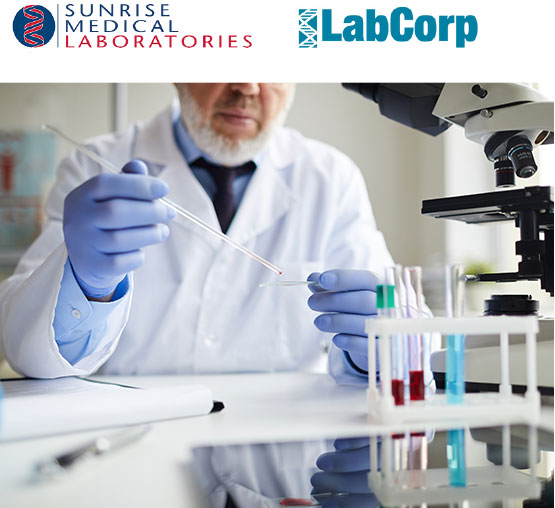 Scientists researching in laboratory in white lab coat.