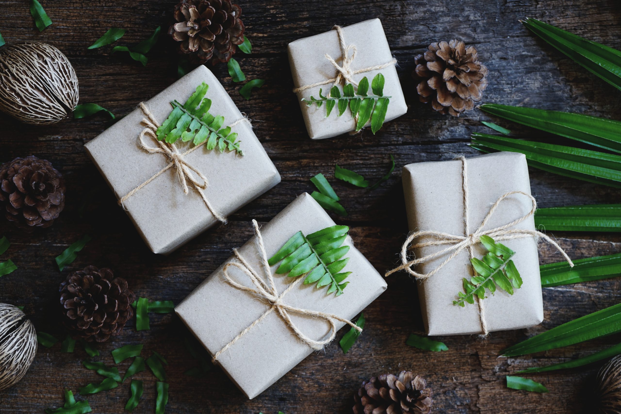 Eco friendly gift boxes wrapped with brown paper, green happy new year present concept