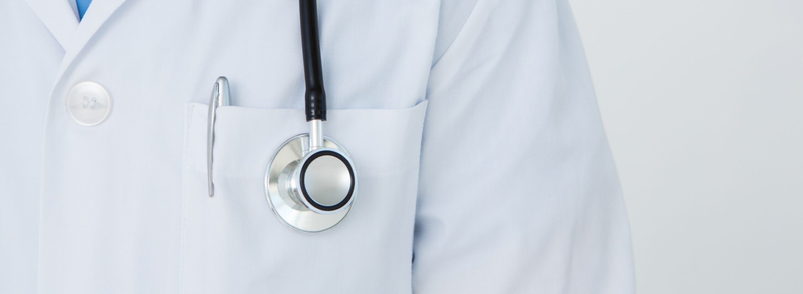 close up of a doctors jacket and stethoscope