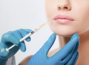 close-up of a woman's mouth about to receive dermal fillers