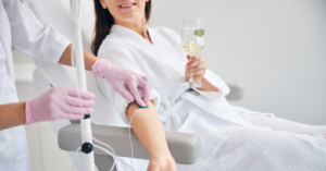 woman receiving iv vitamin therapy treatment at wellness spa