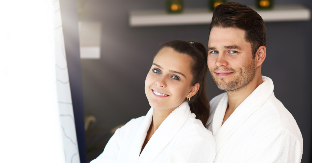 man and woman wearing fluffy white bath robes